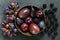 Dark Exotic Fruits on slate background