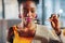 Dark-eyed African-American woman eating yummy sweet dessert