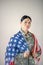 Dark-eyed beautiful military woman holding American flag