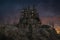 Dark fantasy mysterious gothic vampire castle on a misty mountain after sunset. 3D rendering
