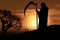 Dark and foreboding silhouette of Grim Reaper at cemetery, Generative AI