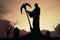 Dark and foreboding silhouette of Grim Reaper at cemetery, Generative AI