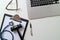 Dark Gavel With Medical Stethoscope near Laptop on white desk In