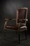 Dark genuine leather vintage chair