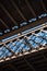 Dark and gloomy industrial atmosphere under the historical rail bridges in Manchester subway symmetry sun rays day summer blue sky