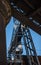 Dark and gloomy industrial atmosphere under the historical rail bridges in Manchester subway symmetry sun rays day summer blue sky