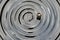 Dark glossy ceramic glass water surface spiral circle pattern backdrop