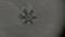 Dark gray background with snowflake that is disappear
