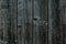 Dark gray green wooden fence. Shabby table, dirty oak, alder tree, pine lumber. Old grey wooden boards. Pattern of wooden surface