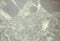 Dark gray marble with a rich layered pattern, close-up of a polished flat surface of natural stone