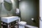 Dark Gray powder room with chrome washstand