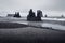 Dark gray rocks on deserted shore of iceland beach