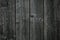 Dark gray shabby boards. Old dark grey fence with hobnail. Antique wooden table. Retro gray wood surface. Old wooden texture backg