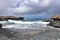 Dark Gray Skies Above the Black Sand Stone Beach in Aruba