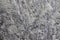 Dark gray stone surface is porous. Grunge abstract stone surface. This is a horizontal background