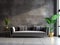 Dark gray velvet sofa against concrete panel wall. Hollywood glam style interior design of modern living room