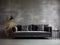 Dark gray velvet sofa against concrete panel wall. Hollywood glam style interior design of modern living room