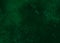 Dark green abstract textured background texture to the point with spots of paint. Blank background design banner.