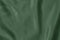 Dark green colored Background of soft draped fabric