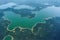 Dark green forest on banks of Iceland aerial river