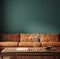 Dark green home interior with old retro leather sofa, table and decor in living room