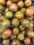 Dark green kumato tomatoes background, Healthy food concept