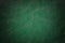 Dark green leather texture background, closeup. Emerald cracked backdrop