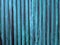 dark green paint on corrugated aluminum zinc fence surface