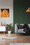 Dark green wall in grey and orange living room