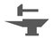 A dark grey anvil and forge hammer symbols icons against a white backdrop