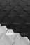 Dark grey and light grey hexagonal relief wall surface - vertical background