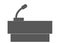 A dark grey simple outline shape of a speaker stand with a microphone for speeches white backdrop