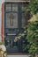 Dark grey stained glass door of an Edwardian house in London, UK