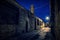 Dark, gritty and wet industrial city alley at night