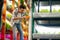 Dark-haired agriculturist wearing squared shirt working in greenhouse