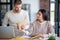 Dark-haired wife giving envelope with letter to her husband