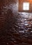 Dark hallway with polished pebbles