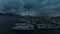 Dark, harbor and boats at sea in winter, vacation or adventure at night. Evening, water and landscape or aerial view of