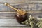 Dark honey in the jar with flowers