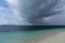 Dark hurricane cloud above tropical sea