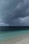 Dark hurricane cloud above tropical sea