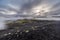 Dark Iceland landscape with green moss and black road, Iceland