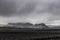 Dark Iceland landscape with green moss and black road, Iceland