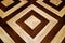 Dark and light brown geometric pattern wooden floor