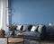 Dark living room interior, blue armchairs with wooden home accessories in modern cozy apartment