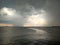 Dark Mediterranean Sea during a storm with coast