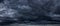 Dark and menacing storm clouds panorama