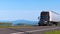 Dark modern truck on background of the river and mountains