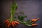 Dark moody food image of fresh carrot