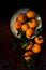 Dark moody food image of fresh ripe orange